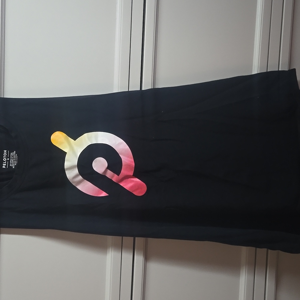 Peloton Black Racerback Tank with Pink-Orange-Yellow Gradient Logo